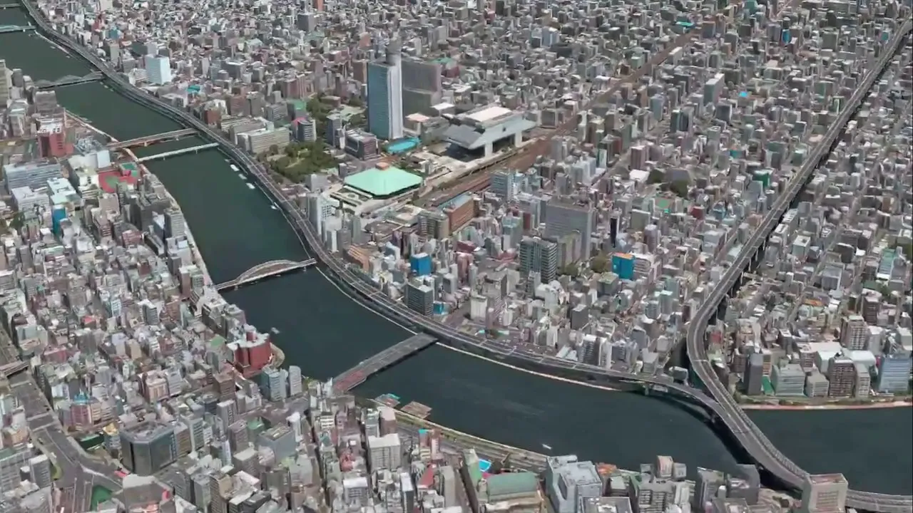 Apple Maps en el modo Flyover sobre las cercanías del río Sumida en Tokio, con el barrio de Ryogoku conocido por su estadio de Sumo al otro lado