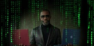 Un hombre con un aire a Morfeo de Matrix nos ofrece dos MacBook Neo en color rojo o azul, ¿cuál eliges? ;)